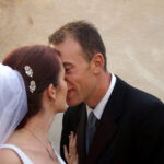 Eskimo kiss for bride and groom
