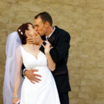 Groom leans in for a kiss