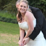 Groom teaches bride to play golf