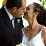 Bride and groom kiss at wedding