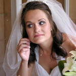 Bride poses in mirror