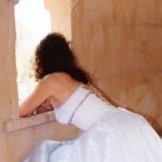 Bride shows off back of dress