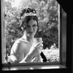 Bride posing with wine glass
