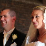Couple smiling at altar