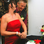 Couple cutting cake at wedding