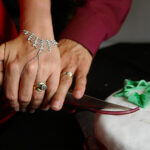 Couple cutting cake together