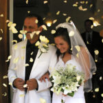 Confetti is thrown as couple leave church