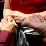 Minister holding out rings to exchange