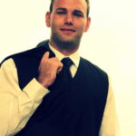 Groom looking serious ahead of wedding