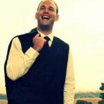 Groom laughing ahead of wedding