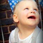 Boy smiling at party