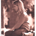 Student studying on lawn