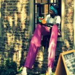 Man on stilts take a break at Victoria Yards