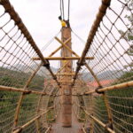 Suspension bridge to Sun City’s maze